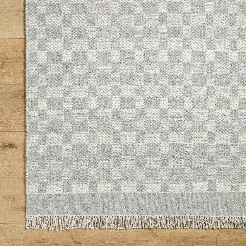 Clinten Solid and Border Ivory Area Rug