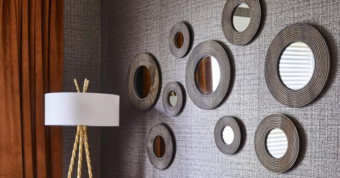 Wall decorated with round mirrors in varying sizes, creating a modern and stylish look.