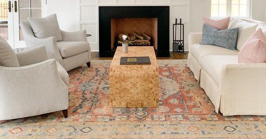Cozy living room featuring a Marrum Traditional Rust Area Rug with neutral furniture.