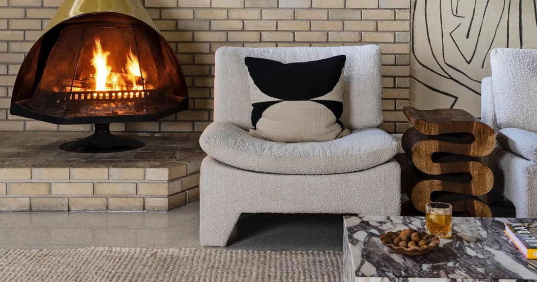 Gray area rug on modern contemporary nook with fireplace.