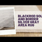 Blackrod Solid and Border Ivory Area Rug